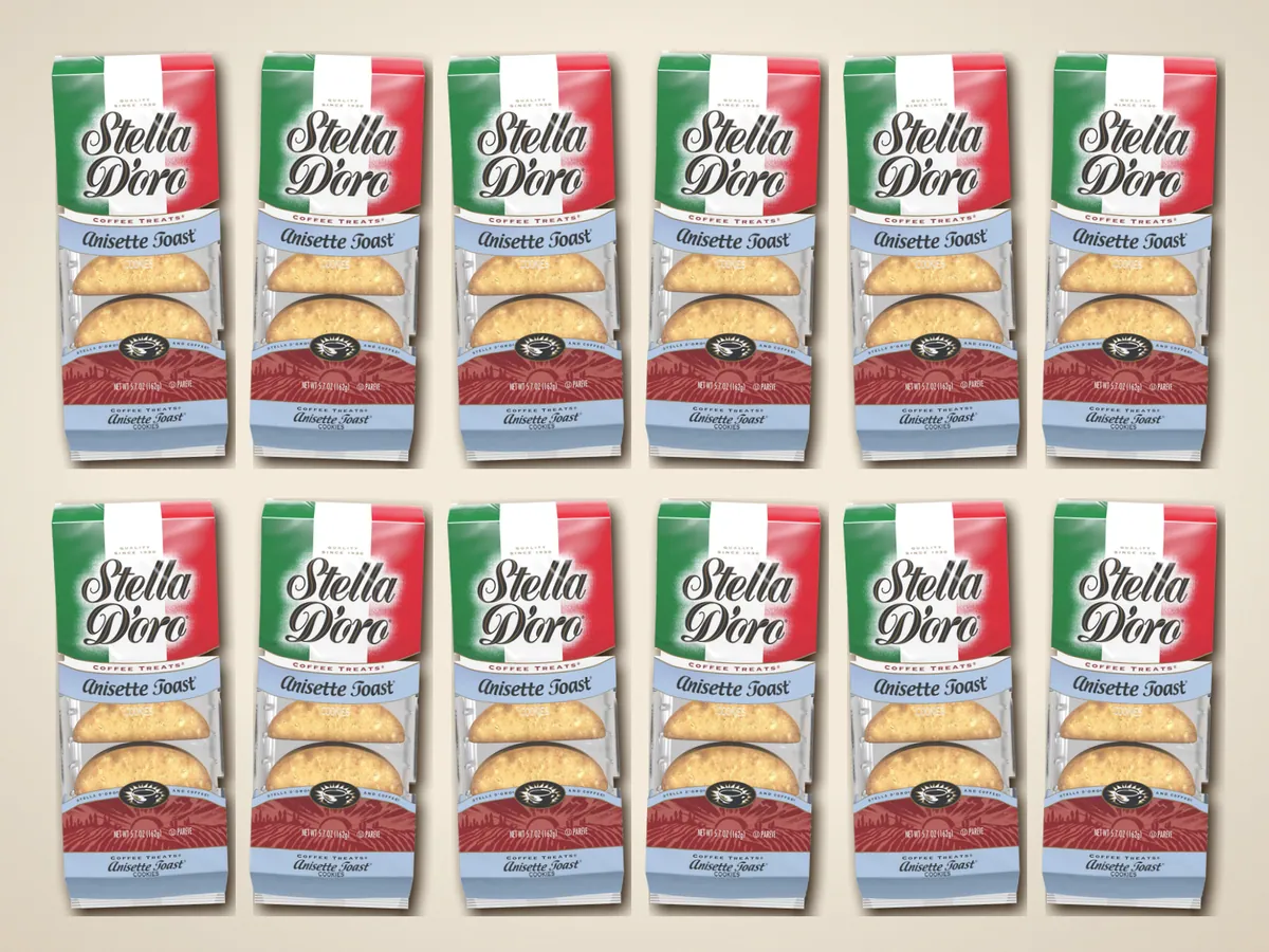 Twelve bags of Stella D'oro Anisette Toast laid out in two rows on a linen tablecloth