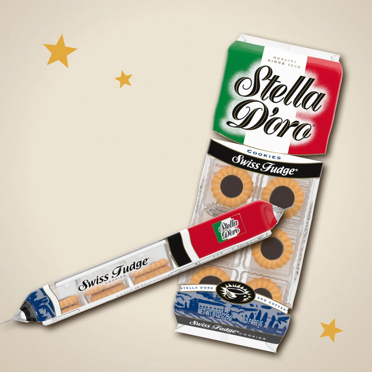 Two packs of Stella D'oro Swiss Fudge cookies on linen with gold stars
